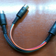 The +12V and Ground in the Front plug are bussed with the same in the Rear, which makes for only two wires to the one. This was good news for me on the 8-pin end; these are not exactly easy connectors to solder to.